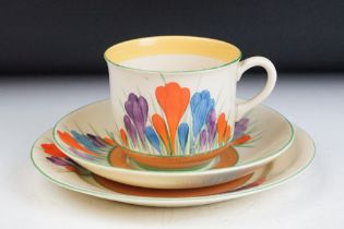 Collection of assorted Clarice Cliff ceramics to include a crocus pattern trio and twin handled bowl