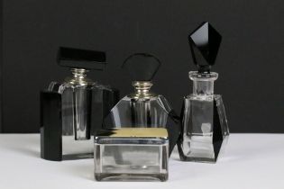 A collection of three Art Deco style scent bottles together with a vanity jar with geometric pattern