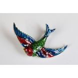 A silver and enamel bird brooch