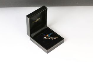 Gilt and enamel swallow brooch