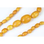 Butterscotch amber style necklace, thirty-three graduated beads, length approx 37cm