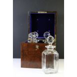 19th century flame mahogany decanter box, opening to a fitted interior holding four glass