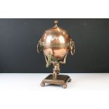 Early 19th century copper samovar, modelled with a kneeling Atlas supporting the globe on his neck
