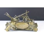 Cast bronze desk-top ink stand modelled as a plough, with inkwell (ceramic liner), the plough with