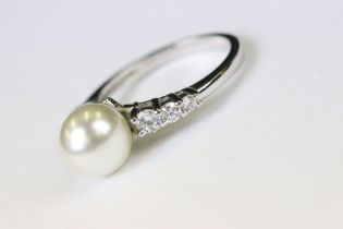 A silver CZ and freshwater pearl dress ring.