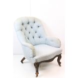 Victorian Blue Upholstered Button Back Armchair raised on carved scrolling legs with castors, 69cm