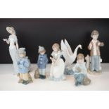 Seven Nao ceramic figurines in their original boxes. The lot to include lady with a butterfly,
