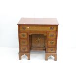 Reproduction George III Burr Yew Small Kneehole Desk with an arrangement of seven drawers around a