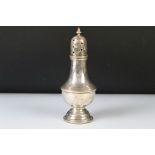 Silver sugar caster, baluster form raised on moulded circular foot, plastic base to foot, head