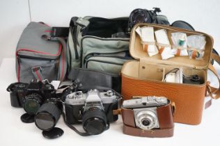 Group of 35mm SLR cameras, lenses and equipment etc, to include: a Pentax P30 and Yashica FX-2