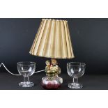 Large cranberry and colourless glass brass topped scent bottle, two large glass goblets and a Goebel