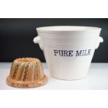 Victorian style ceramic milk pale of tapering form having moulded twin handles and 'pure milk'