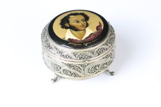 Hand painted circular filigree trinket pot raised on three scroll feet, the hinged lid with hand