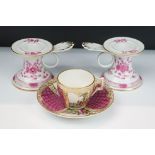 Pair of Meissen porcelain candlesticks having pink and gilt floral detailing with fan shaped