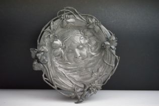 An Art Nouveau WMF pewter tray, by Albert Mayer, cast in low relief with the portrait of a girl, the