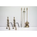 Group of brass coated fire irons to include a pair of fire dogs, tongs poker and shovel. Shovel