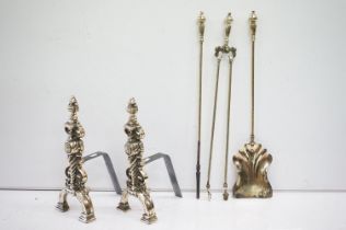 Group of brass coated fire irons to include a pair of fire dogs, tongs poker and shovel. Shovel