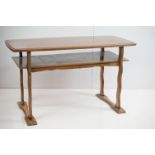 Mid 20th century Teak Rectangular Coffee Table with shelf below raised on shaped supports, 101cm