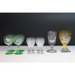 Selection of 19th Century glasses to include a yellow flash glass goblet, four green glasses with