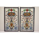 Pair of contemporary stained glass wall hanging panels of rectangular form, with floral & ribbon