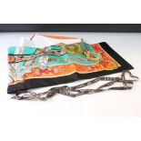 Hermes silk scarf depicting horse heads, unicorn heads, buckles and belts, green, turquoise,
