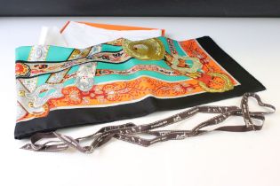 Hermes silk scarf depicting horse heads, unicorn heads, buckles and belts, green, turquoise,