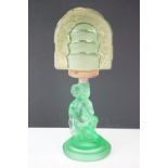 Art Deco 1930s pressed green glass lamp base in the form of a crouching female figure having an