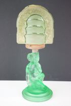 Art Deco 1930s pressed green glass lamp base in the form of a crouching female figure having an