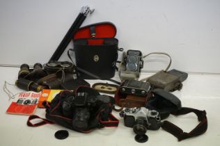 Collection of cameras and binoculars to include a Canon Eos &00 film camera with a 35-80mm lens,