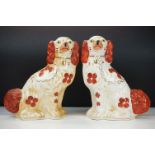 Pair of 19th Century Victorian Staffordshire fire dogs in the form of spaniels. Measures 30cm tall.