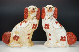 Pair of 19th Century Victorian Staffordshire fire dogs in the form of spaniels. Measures 30cm tall.