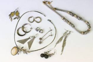 Group of white metal jewellery to include two pairs of hoop earrings and pair of purple stone stud