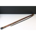 Japanese walking stick with carved figures to the sides, together with an ebonised wood swagger