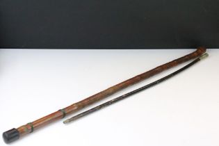 Japanese walking stick with carved figures to the sides, together with an ebonised wood swagger