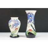 Pair of Moorcroft ceramic vases in the Fly Away Home pattern featuring tube lined florals with