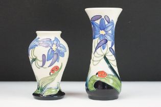 Pair of Moorcroft ceramic vases in the Fly Away Home pattern featuring tube lined florals with