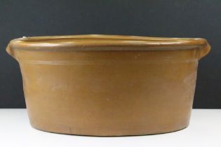 Large 19th Century Victorian salt glazed Dairy Bowl of oval form with twin handles. Measures 23 x 54