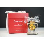 Baccarat for Cabochard limited edition perfume bottle having a square faceted bottle base with a bow