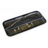 19th century Japanese black lacquered twin-compartment pen tray, with chinoiserie gilt figural