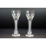 Pair of 20th Century double series air twist glasses both having ground pontils to the bases.