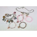 Collection of Disney jewellery which includes multi charm bracelet.
