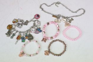 Collection of Disney jewellery which includes multi charm bracelet.