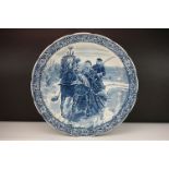 Early 20th Century Delfts Boch blue and white ceramic wall charger featuring a printed scene of a