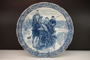 Early 20th Century Delfts Boch blue and white ceramic wall charger featuring a printed scene of a