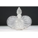 Lalique frosted glass perfume bottle having a central moulded flower on a sun burst moulded
