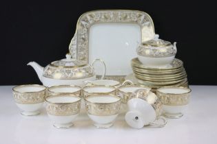 Wedgwood Gold Florentine tea service having a white ground with gilt classical detailing. The lot to