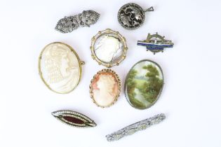 Three cameo brooches including one carved mother of pearl example, a hand painting mother of pearl