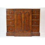 Burr Elm Breakfront Cabinet in the George III manner, with a central cupboard flanked by eight small