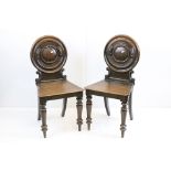 Pair of 19th century Mahogany Hall Chairs with circular moulded backs and solid seats, 85cm high x