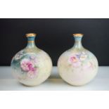 Pair of Royal Bonn German bulbous vases each being hand painted with floral sprays with scrolled